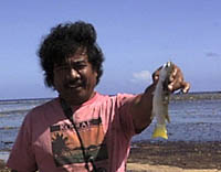Nena catches a fish